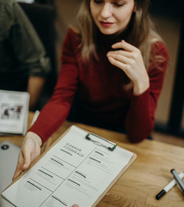 Woman Holding Clipboard