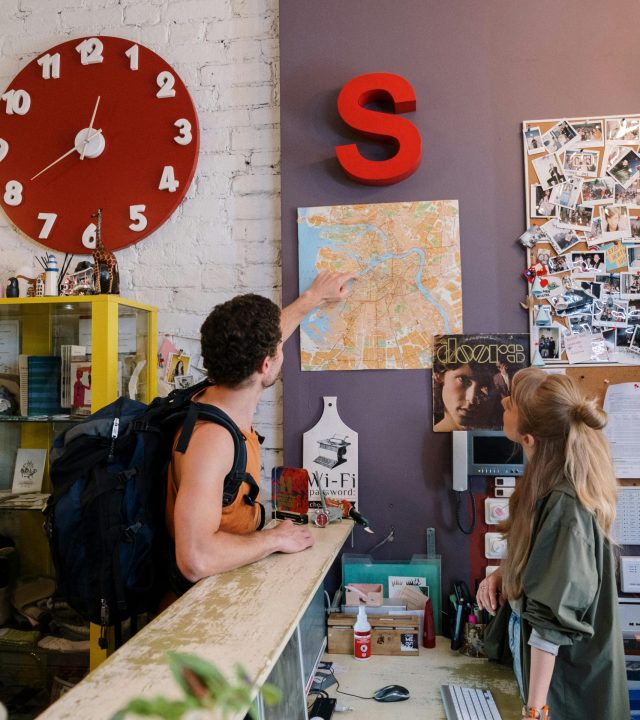 Tourist Pointing on Map